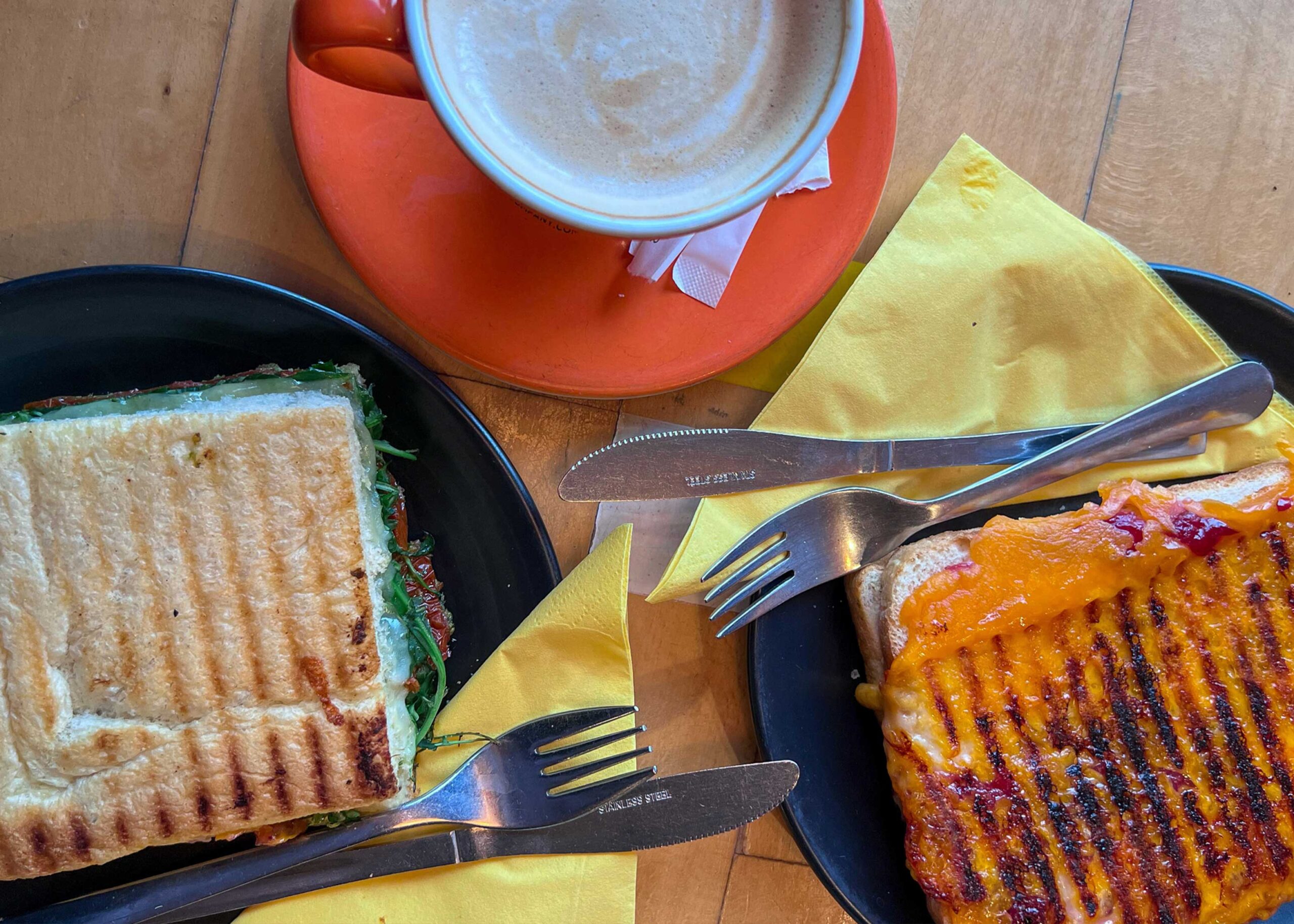 Birds eye view of toasties and a latte from Manna House Bakery