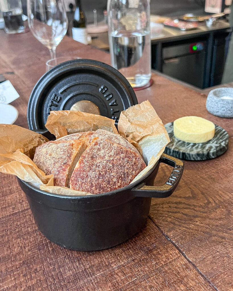 Warm bread in a black cast iron dish from the Avery x Argile collab