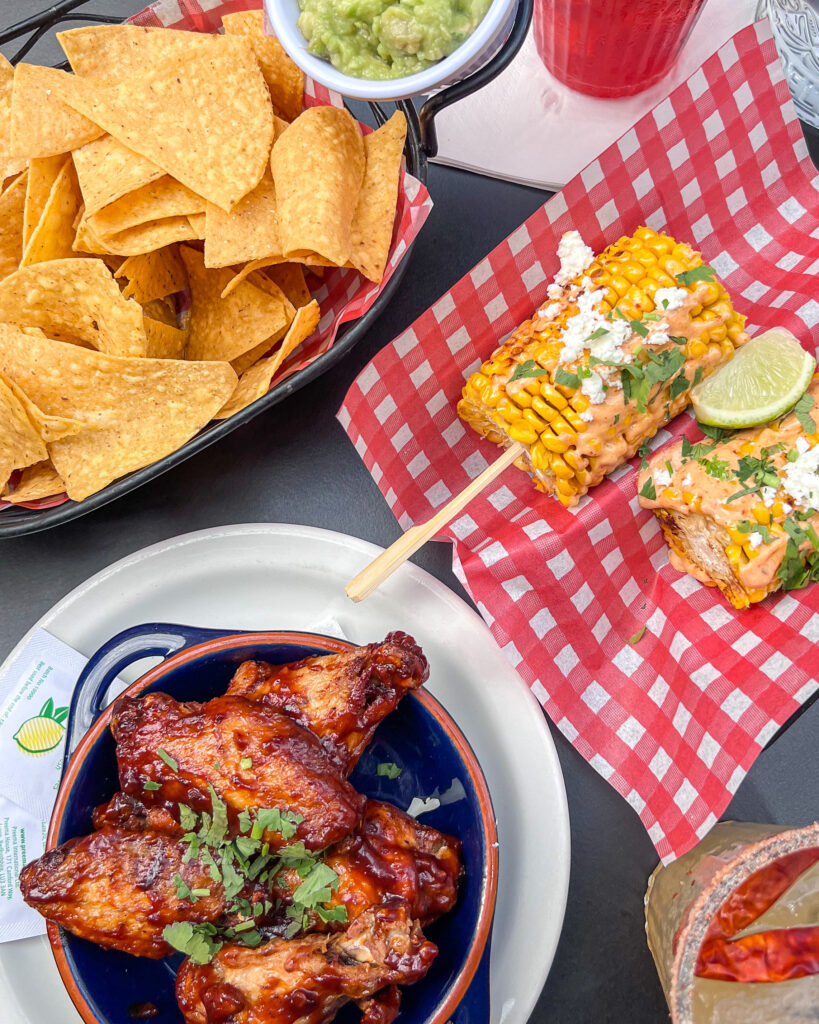 BBQ chicken wings, tortilla chips and corn from Mariachi
