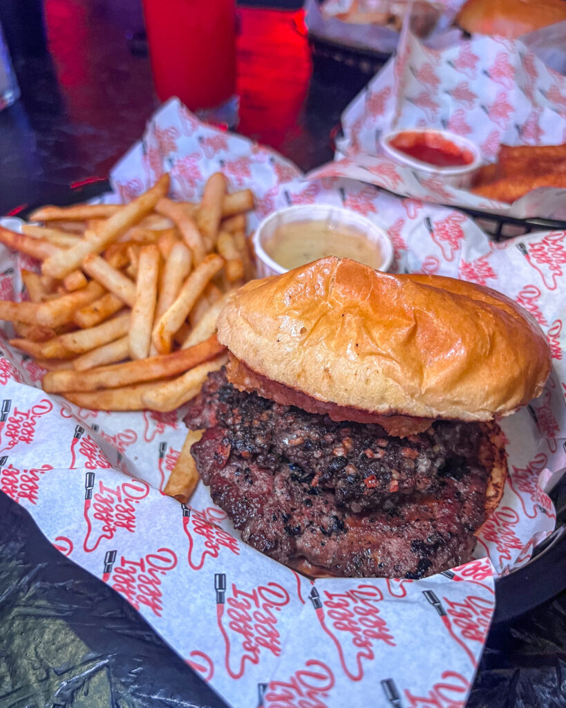 A burger with haggis and a side of fries