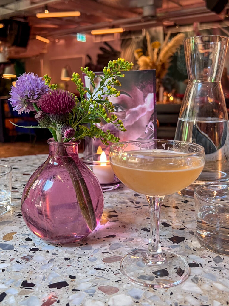 Cocktail and flowers from Eve